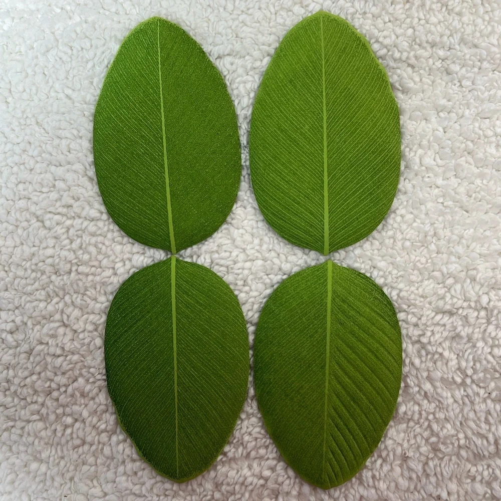 Design Idea Bali Hai Leaf-Shaped Table Textiles in Deep Green w/Olive Accents